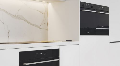 A black Commercial Built-in Oven installed in a white kitchen