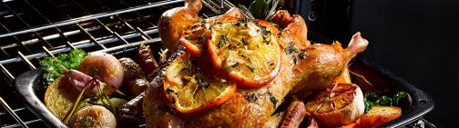 Roast chicken with vegetables fresh out of a Belling oven