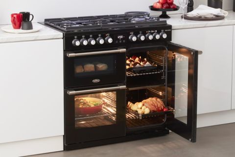 Black Belling CookCentre Deluxe cooker with food cooking inside which can be seen through the glass doors