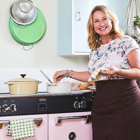 Nici Wickes cooking with her pink custom coloured Richmond Deluxe range cooker