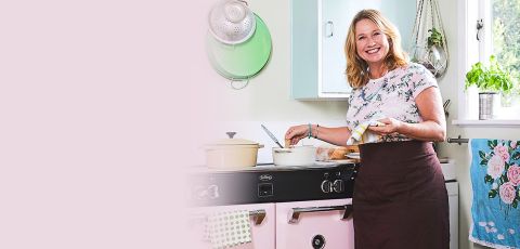 Nici Wickes cooking with her pink custom coloured Richmond Deluxe range cooker